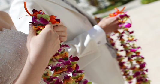 Wedding couple holding colorful leis